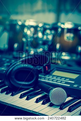 Microphone On Music Keyboard With Music Brand Blurred Background, Music Instrument Concpet