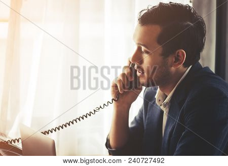 Business Man Is Making Call In On Fax Phone Landline
