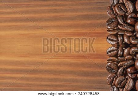 Coffee Bean On A Brown Wooden Background. Located On One Side. Large Size, Billboard, Background, Te