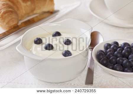 Yogurt And Bluberries Breakfast - Yoghurt With Bluberries For Breakfast With Coffee And Croissant.