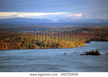 Mountains And Squam Lake In New Hampshire At Fall Time