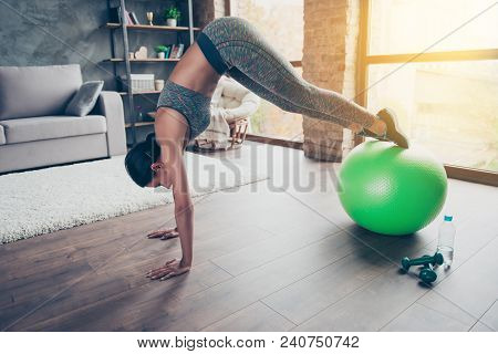 Side Profile View Photo Of Strong Flexible Beautiful Sportive Athlete Wearing Tight Leggings And Top