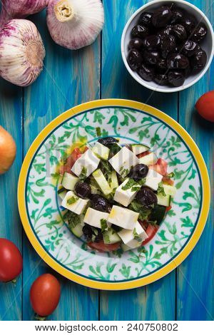 Greek salad with feta cheese cubes and fresk vegetables