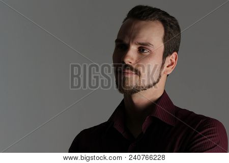 Face Of Handsome Man With Fashionable Hairstyle Half Closed In Shadow