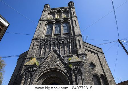 Looking Up At The Tower Of St. Botolphs Church In The Market Town Of Colchester In Essex, Uk.
