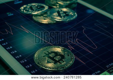 Cryptocurrency Gold Silver Metal, Focus On Bitcoin Sign, Coins Put On Modern Tablet Screen That Show