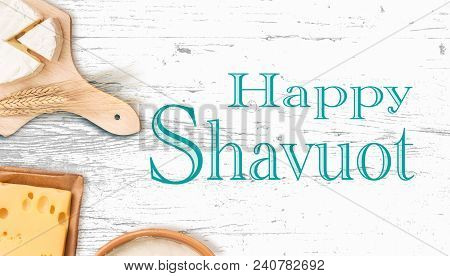 Happy Shavuot, Background With Dairy Products On Wooden Tabletop