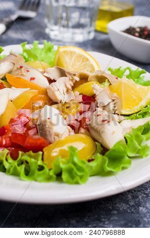 Fish Fillet With Raw Vegetables And Lemon In A Dish On The Table. Selective Focus.