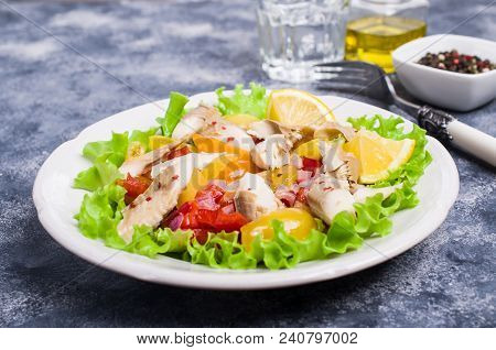Fish Fillet With Raw Vegetables And Lemon In A Dish On The Table. Selective Focus.