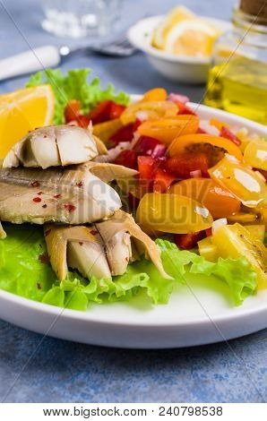 Fish Fillet With Raw Vegetables And Lemon In A Dish On The Table. Selective Focus.
