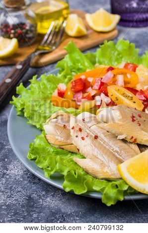 Fish Fillet With Raw Vegetables And Lemon In A Dish On The Table. Selective Focus.