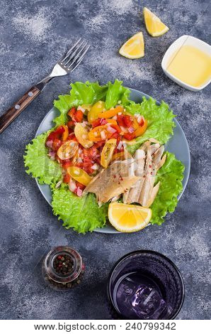 Fish Fillet With Raw Vegetables And Lemon In A Dish On The Table. Selective Focus.