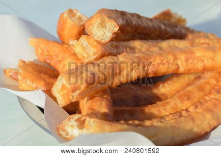 Typical Spanish Snack Churros Are Deep-fried Pastries  And Served With Hot Chocolate Everywhere In S