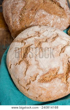 Farmers Homemade Organic Wheat, Barley And Rye Bread In Assortment On Table