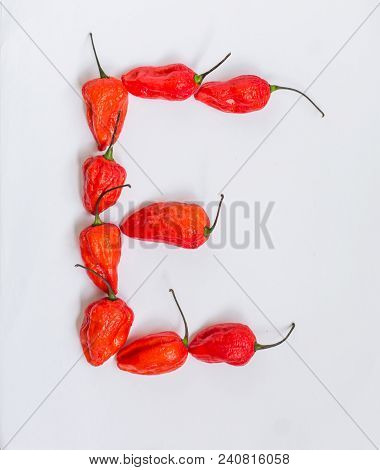 Letter E Alphabet Made With Ghost Pepper Bhoot Jolokia Over White Background