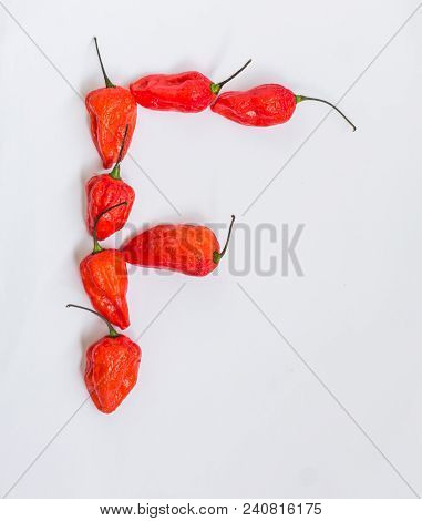 Letter F Alphabet Made With Ghost Pepper Bhoot Jolokia Over White Background