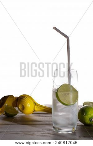 Stil Mineral Drink Water In Glass Bottle Served With Three Glasses With Ice Cubed, Lime And Lemon