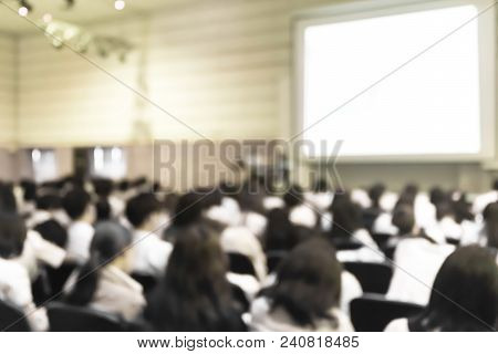 Blurred Abstract Background Of Business Or Educational Conference Seminar In Auditorium Hall