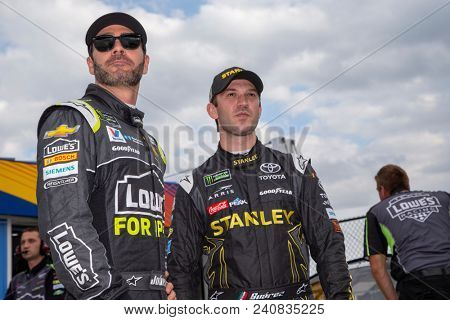 May 11, 2018 - Kansas City, Kansas, USA: Daniel Suarez (19) and Jimmie Johnson (48) chat before qualifing for the KC Masterpiece 400 at Kansas Speedway.