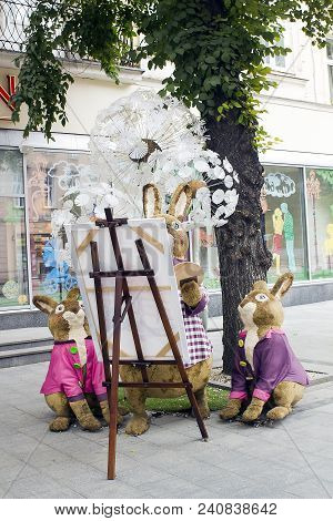 Lviv, Ukraine - July 08, 2017: Family Of Rabbits Toys Decoration Near Candy Shop Roshen On City Stre