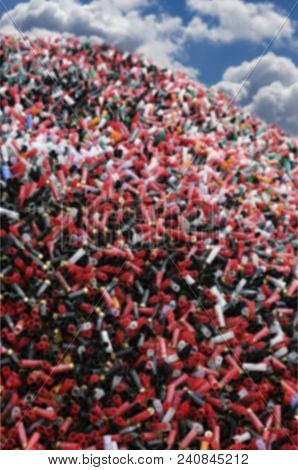 Blurred Abstract Background Of Sport Cartridges. Sports Shooting On Skeet.  A Mountain Of Cartridges