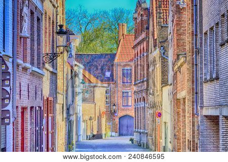 Street View With Medieval Traditional Houses In Popular Belgian Destination Bruges, Belguim