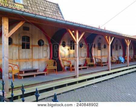 Stavoren, Holland - April 22, 2018: Wine Vat Hotel Rooms In Dutch Fishing Village Of Stavoren