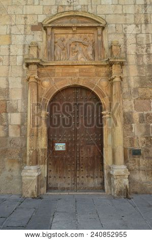 Beautiful Front Facade Of The Church Of Alcala De Henares University With A Nest Of Storks In Its Ol