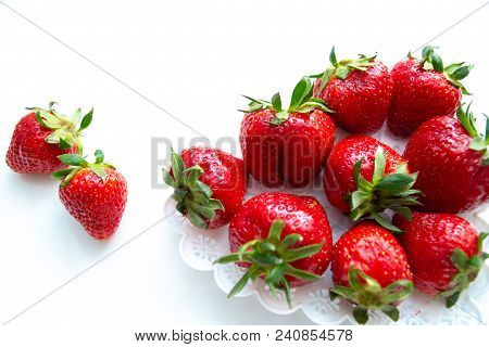 Strawberry Scattered On A White Background Isolate.