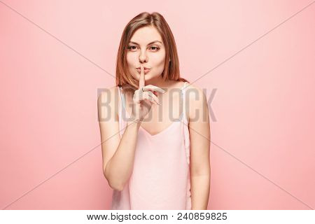 Secret, Gossip Concept. Young Woman Whispering A Secret Behind Her Hand. Business Woman Isolated On 