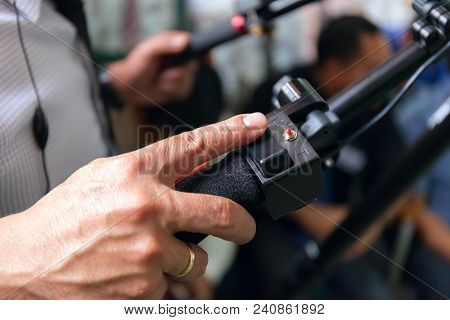 Close-up Of Working Camera Of Man Hand, Operator At Work. Stock Photo