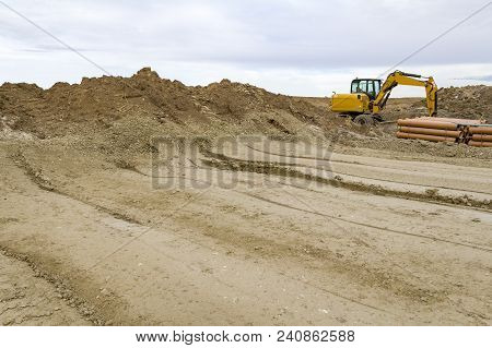 A Excavator At A Loamy Construction Site