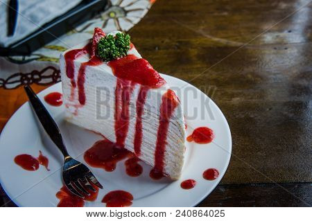 Strawberry Crape Cake On Wood Table In Coffee Shop , Dessert Tasy Cake
