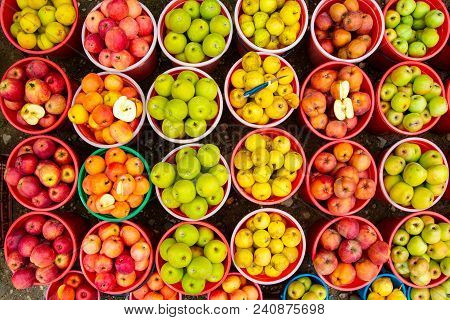 Bright Multicolored Apples In Buckets, Top View