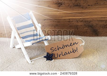 Sunny Summer Label With Sand And Aged Wooden Background. German Text Schoenen Urlaub Means Happy Hol