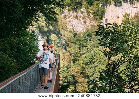 Zeda-gordi, Georgia- September 13, 2017: People Walking On Narrow Suspension Bridge Or Pendant Road 