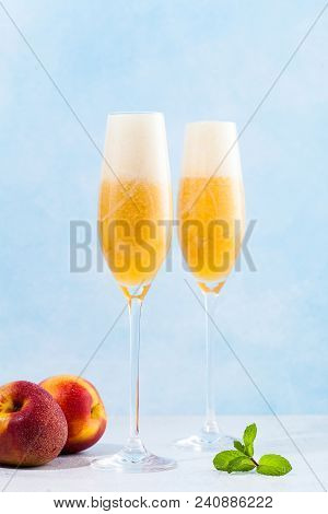 Two Glasses Of Champagne With A Cocktail Of Bellini And Fresh Pe