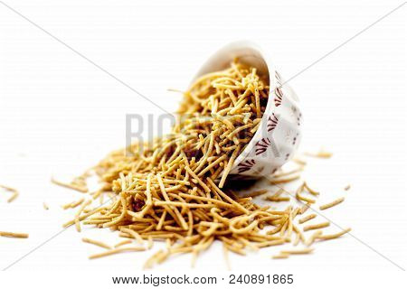 Popular Indian & Gujarati Dish Aloo Sev Or Potato Sev Or Mint Flavored Sev In A Bowl Isolated On Whi