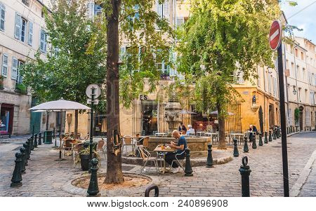 Aix-en-provence, France - October 9, 2009: People Dining In Cosy Street Cafe Near Fountain Named Fon