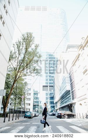 A Business Woman In A Big City Speaks By Phone. A Working Woman Spoke On Her Cell Phone On The Stree