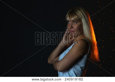 Nice Girl In The White Shirt And Water Drops Behind And Arround Her Illuminated By Light During A Ph