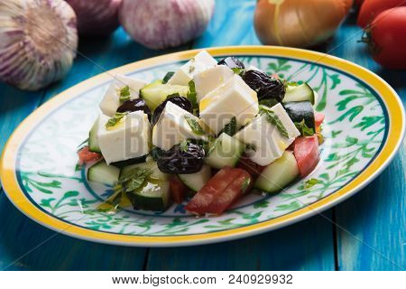 Greek salad with feta cheese cubes and fresk vegetables