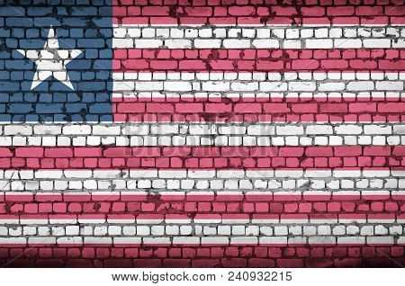 Liberia Flag Is Painted Onto An Old Brick Wall