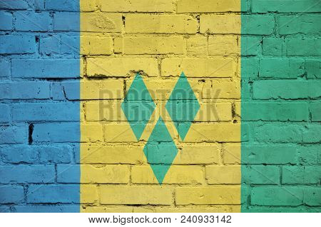 Saint Vincent And The Grenadines Flag Is Painted Onto An Old Brick Wall
