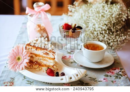 Tasty Oldfashioned Cake With Cream Icing Served With Tea And Raw Apples On Shabby Turquoise Table.