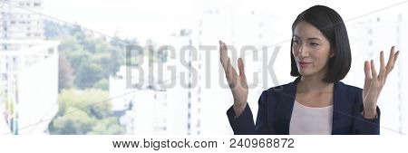 Businesswoman with hands palm open in city
