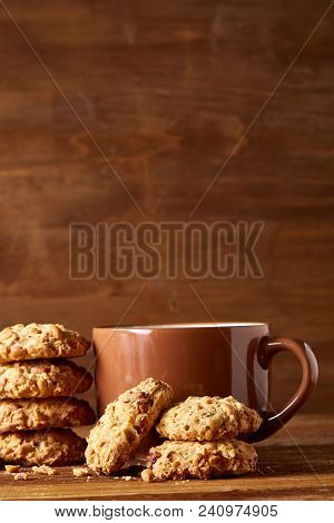 Porcelain Cup Of Black Tea Or Earl Grey And Pile Of Sweet Cookies On Rustic Wooden Background, Top V