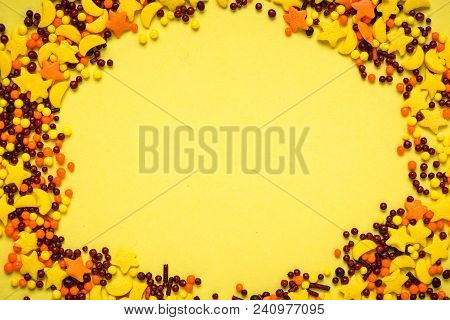 Colorful Nonpareil On Yellow Background. Top View