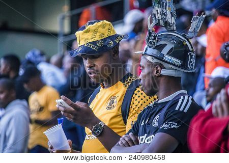 Cape Town, South Africa, 12 May 2018 - Diverse South African Football Supporters Checking Score On T