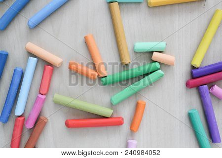 Pastel Crayons On Woden Table. Artist Suply